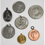 Seven royal commemorative medallions including Queen Victoria, George V and George VI