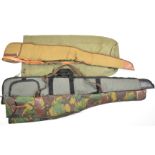 Three padded shotgun or rifle slips and a canvas game or decoy bag.