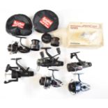 A collection of fixed spool fishing reels including Shimano baitrunners 5010 and 6010 and Mitchell