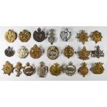 A small collection of badges including Royal Tank Corps, Royal Armoured Corps, Royal Air Force,