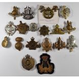 Twenty British Army cap badges including Army Educational Corps, Army Cyclists Corps, Royal