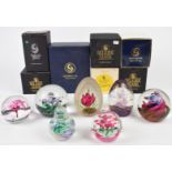 Seven Selkirk glass paperweights including magnum and limited editions, most with paper labels to