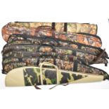 Seven padded shotgun or rifle slips, all with camouflage finish.