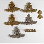 Seven British Army Royal Artillery badges including the Third Middlesex R.G.A. Volunteers, the