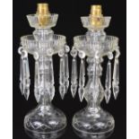 A pair of clear cut glass drop lustre lamps, 30cm tall.