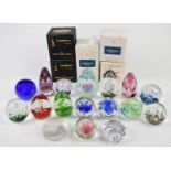 Seventeen Langham, Caithness, Mats Jonasson and similar glass paperweights including some limited