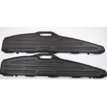 Two rifle or shotgun hard carry or flight cases GunGuard and DoskoSport, both with padded interiors,