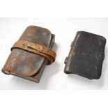 Leather ammunition pouches, one with internal tin plate compartment retaining its pull/extraction