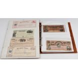 American Civil War interest banknotes in album and framed display of four cheques including