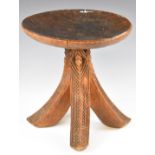 African tribal four legged carved stool, height 30cm