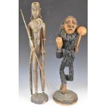 African tribal figures including intricately carved figure with knobkerrie, tallest 67cm