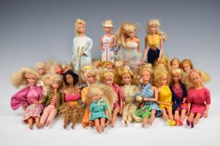Twenty-five Mattel Barbie dolls of various ages together with a collection of original clothing