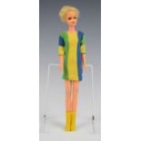 Mattel Twiggy Barbie doll wearing a blue/green/yellow striped dress and yellow boots, c.1967, height