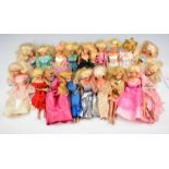 Eighteen Mattel Barbie dolls dressed in evening clothing, with accessories.