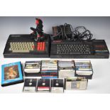 Sinclair 128K ZX Spectrum +3 with power supply, a collection of games and a DK'Tronics keyboard.