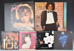 A collection of approximately 50 albums plus 7