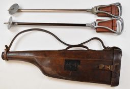 Brown leather leg of mutton shotgun case (78cm long) and two shooting sticks.