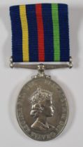 Civil Defence Long Service Medal for W T Higgins, with fitted box, paperwork and postal box