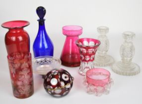 Ten pieces of glassware including Bristol blue brandy decanter, cranberry lily / hyacinth vase, a