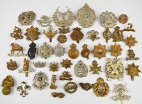 Forty five mostly British Army cap badges including Scots Guards, Coldstream Guards, North