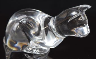 Baccarat clear glass paperweight in the form of a cat, signed to base, 12cm long.