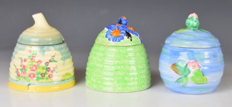 Clarice Cliff for Newport and Wilkinson Pottery three Art Deco honey / preserve pots, tallest 11cm