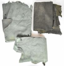 Three leather animal hides including one elephant or similar example, largest approximately