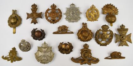 Seventeen British Army and Royal Marines cap badges including Royal Artillery, Honourable