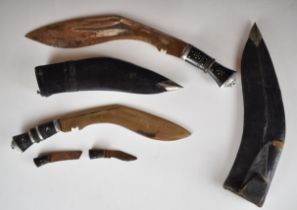 Two Kukri knives, both with sheaths and India etched to blade, longest blade 29cm, and a smaller