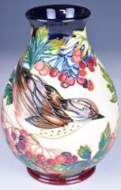 Moorcroft pottery pedestal baluster vase decorated with thrush and jay birds amongst foliage,