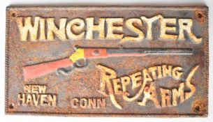 Winchester Repeating Arms cast iron shop display or adverting wall plaque, 17x31cm
