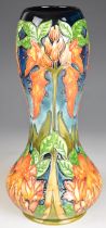 Moorcroft pottery gourd shaped trial vase with stylised orange flower decoration, height 29cm