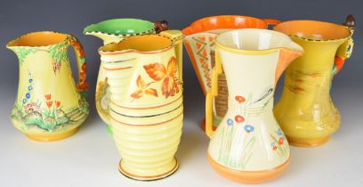 Six Art Deco pottery jugs including Burleigh Ware Highwayman, Pied Piper, Wadeheath, Myott etc,