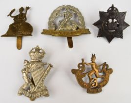 Five cap badges comprising 3rd Winnipeg Regiment, two Norfolk Regiment with one stamped Gaunt to