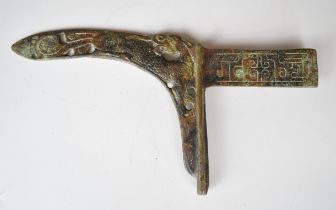 Ancient Bronze Age or similar dagger with pierced and embossed decoration and curved blade, 29cm