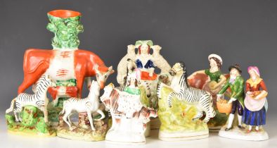 19thC Staffordshire figures including two pairs of zebras, cow and calf spill vase, cow with