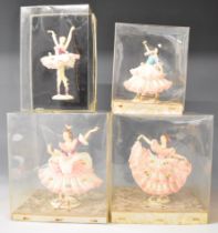 Four Dresden lace porcelain figurines, sealed in original boxes, tallest 17cm