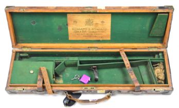 Holland & Holland leather and brass bound wooden shotgun case with fitted interior, lock, key and