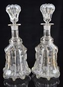 Pair of Victorian bell shaped moulded and cut glass decanters, 33cm tall.