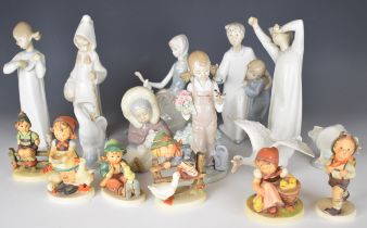 Ten Lladro child and bird figures together with six Goebel Hummel figures, tallest 20cm