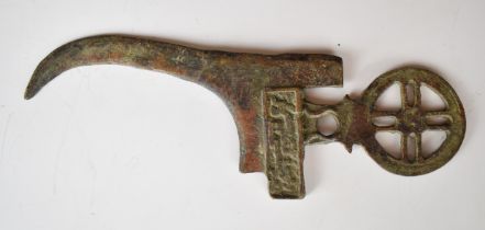 Ancient Bronze Age or similar dagger with pierced and embossed decoration and curved blade, 26.5cm