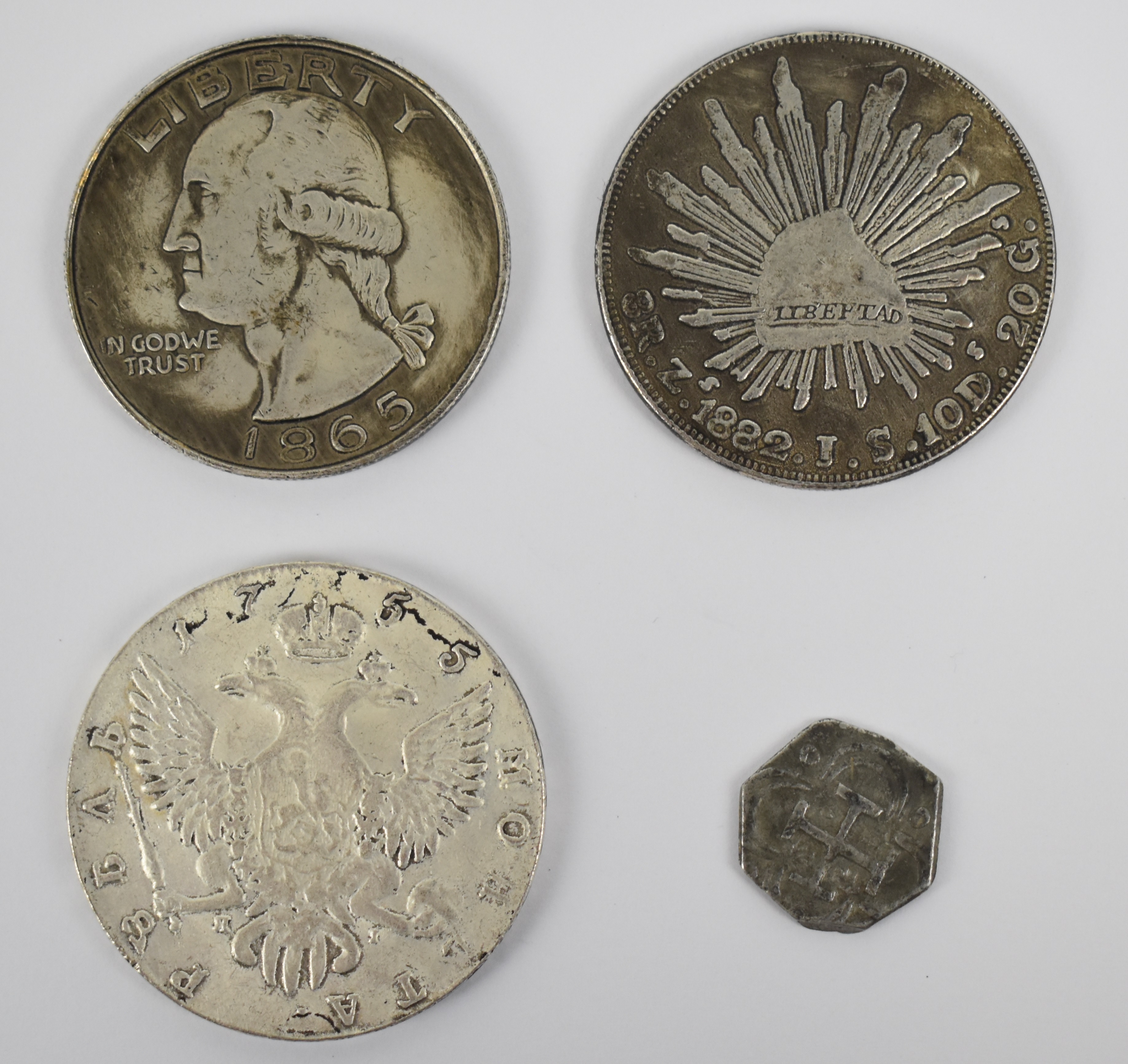 Four replica coins comprising USA Washington $1, Russian rouble, Mexican 8 reales and a Spanish