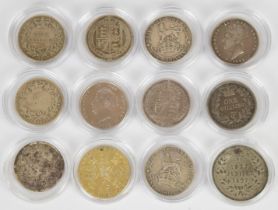 A collection of twelve coins, mainly shillings but includes a Queen Victoria commemorative