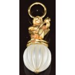 Charles Garnier 18ct gold pendant depicting a cherub playing a lute sitting on a rock crystal ridged