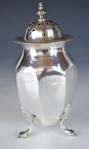 George V hallmarked silver sugar caster of octagonal ovoid form, raised on three legs, Birmingham