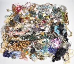 A collection of costume jewellery including necklaces, bangles, vintage and silver brooches,