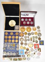 Cased coins to include Battle of Britain set, other coins, ingots and medals including Titanic,