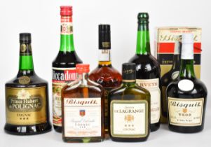 Seven bottles of Cognac, Sherry and Vermouth to include Bisquit VSOP Cognac 24fl oz, 70 proof.