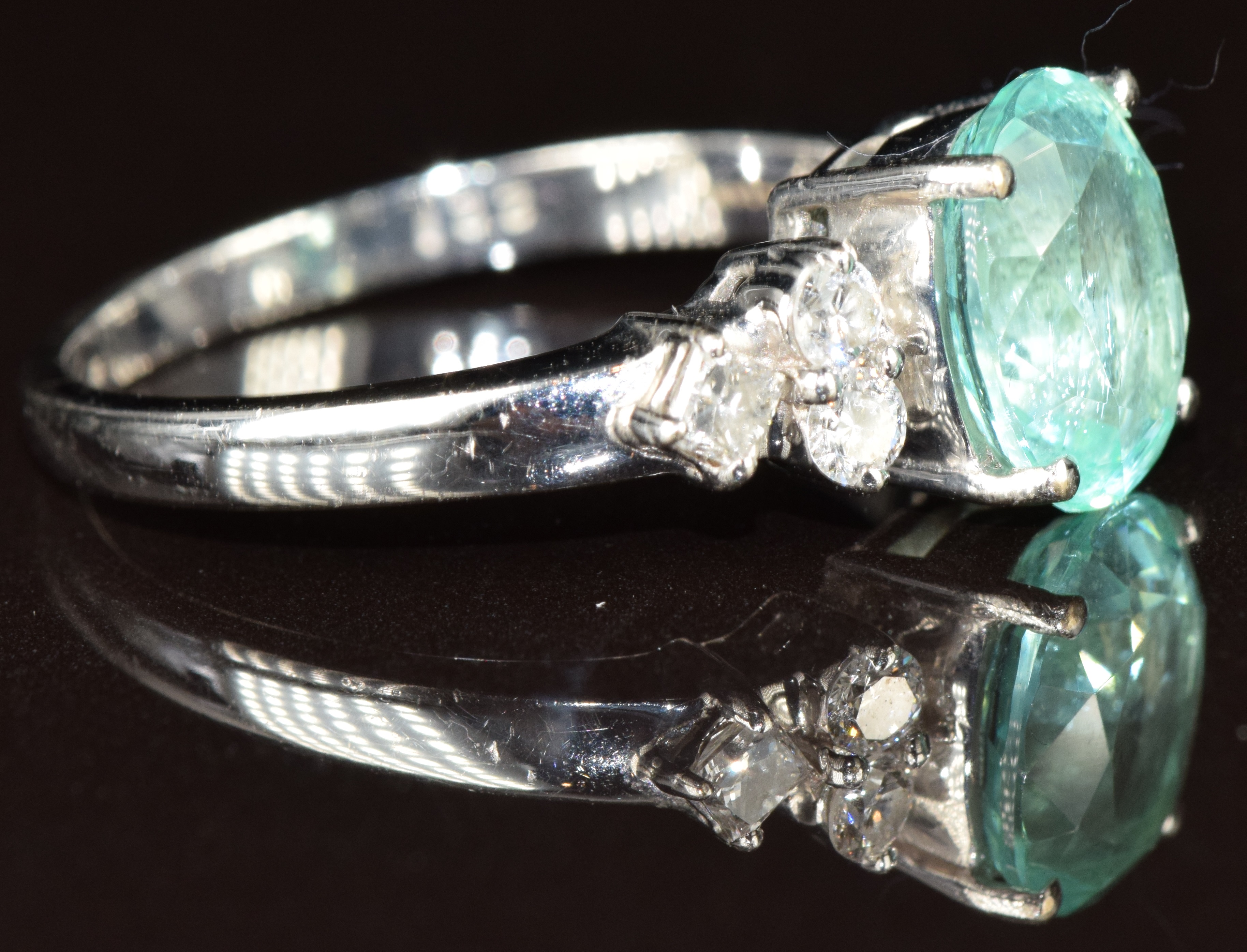 An 18k white gold ring set with an oval cut Paraiba tourmaline of approximately 1.4ct and - Image 2 of 2