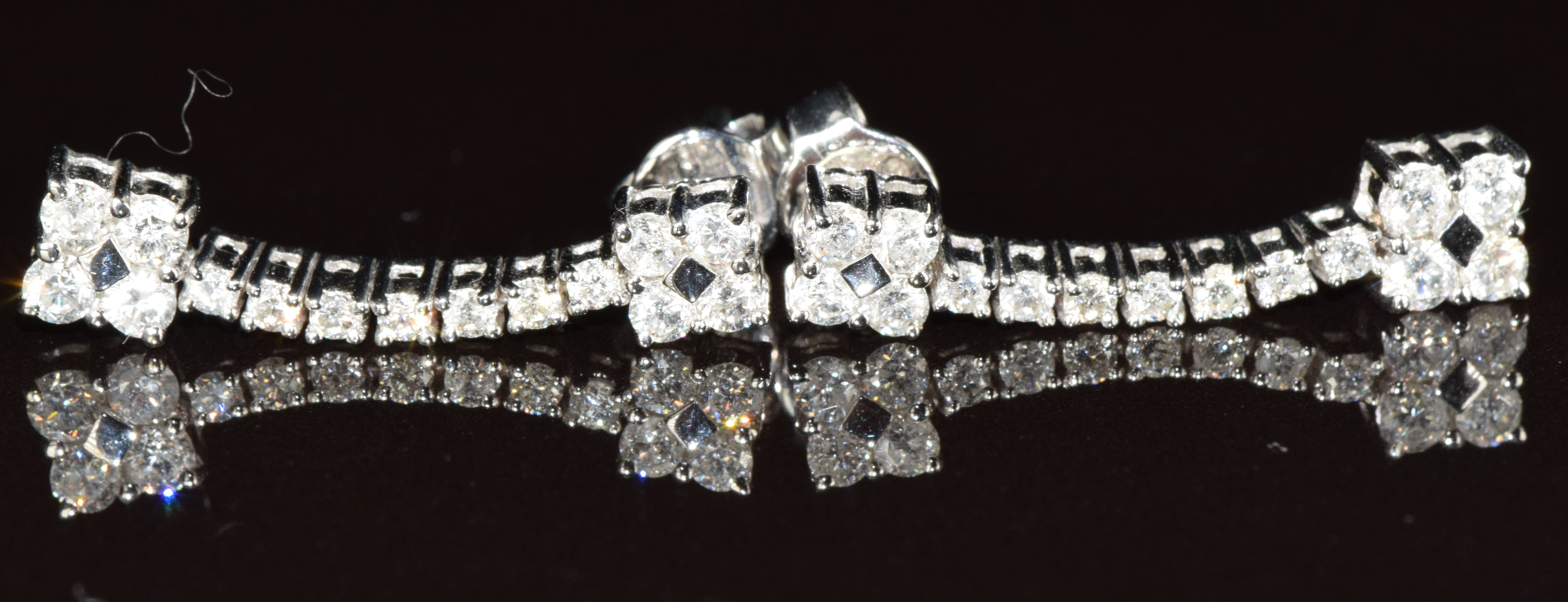 A pair of 18ct white gold earrings set with diamonds, 3.6g, 2.2cm